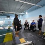 wheelchair users at a swimming pool