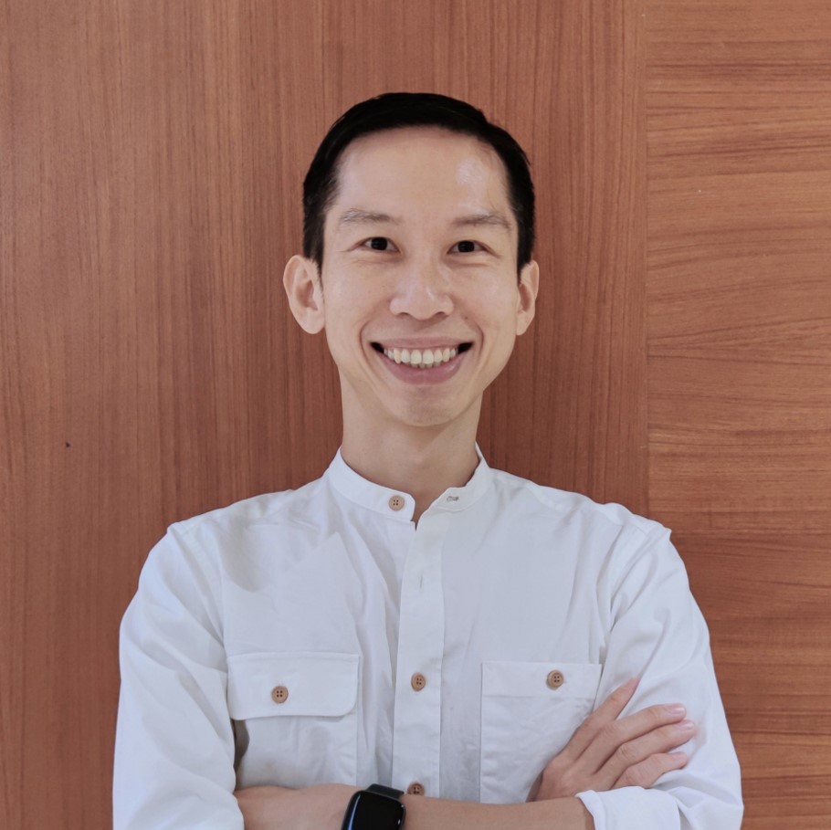 trainer yock song standing against a wall