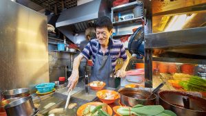 male hawker cooking