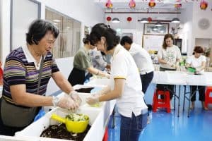 group of people doing composting