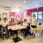 Enabling Village - Group of wheelchair users and Visually impaired with guide dog at AMGD restaurant