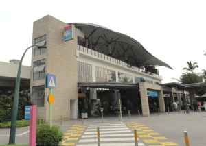 Exterior of Beach Station at Sentosa, with a sheltered entrance and pedestrian crossing in front.