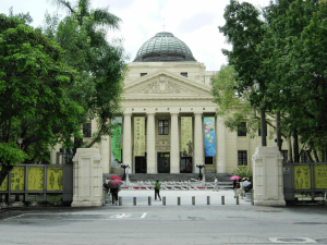 Front view of the National Taiwan Museum’s historic domed building, surrounded by trees in Taipei.