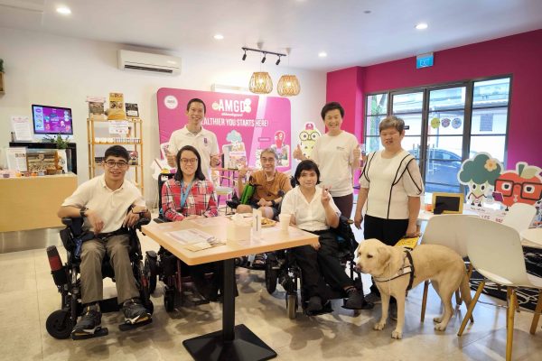 Enabling Village - Group of wheelchair users and Visually impaired with guide dog at AMGD restaurant